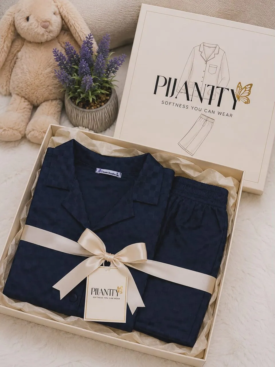 Pijamty gift box with a gold ribbon